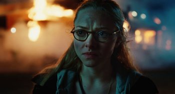 Movie still from “Jennifer's Body” (2009), directed by Karyn Kusama – A person wearing glasses; Close Up shot, Over the shoulder angle