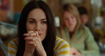 Movie still from “Jennifer's Body” (2009), directed by Karyn Kusama – A beautiful young woman sitting in front of another woman; Close Up shot, Over the shoulder angle