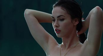 Movie still from “Jennifer's Body” (2009), directed by Karyn Kusama – A beautiful woman with a bare chest and necklace; Close Up shot, Low angle