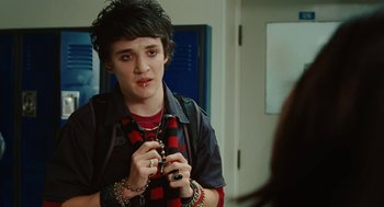 Movie still from “Jennifer's Body” (2009), directed by Karyn Kusama – A person holding a cell phone in their hands; Close Up shot, Over the shoulder angle