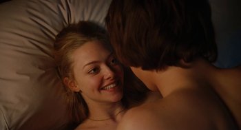 Movie still from “Jennifer's Body” (2009), directed by Karyn Kusama – A woman laying in a bed with a man; Close Up shot, Overhead angle