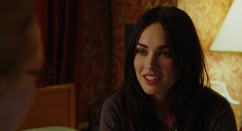 Movie still from “Jennifer's Body” (2009), directed by Karyn Kusama – A beautiful woman sitting at a table in front of a mirror; Close Up shot, Over the shoulder angle