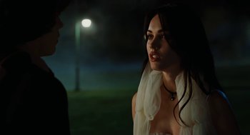Movie still from “Jennifer's Body” (2009), directed by Karyn Kusama – A beautiful young woman wearing a white dress; Close Up shot, Over the shoulder angle