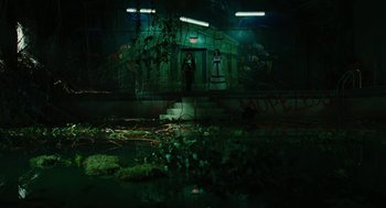 Movie still from “Jennifer's Body” (2009), directed by Karyn Kusama – A person standing in a dark room next to a building; Extreme Wide shot, High angle