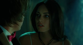 Movie still from “Jennifer's Body” (2009), directed by Karyn Kusama – A beautiful young woman with long dark brown hair; Close Up shot, Over the shoulder angle