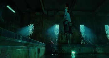 Movie still from “Jennifer's Body” (2009), directed by Karyn Kusama – Two people are standing in the water in a building; Wide shot, Low angle