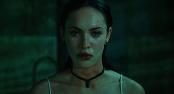Movie still from “Jennifer's Body” (2009), directed by Karyn Kusama – A person wearing a necklace; Close Up shot, High angle