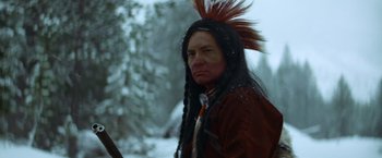 Movie still from “Jeremiah Johnson” (1972), directed by Sydney Pollack – A man in a native american costume standing in the snow; Close Up shot, Low angle
