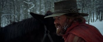 Movie still from “Jeremiah Johnson” (1972), directed by Sydney Pollack – A man with a beard wearing a cowboy hat; Close Up shot, Low angle