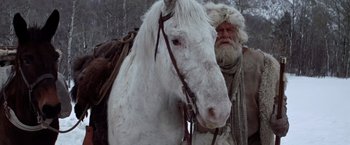 Movie still from “Jeremiah Johnson” (1972), directed by Sydney Pollack – An old man with a beard and a white horse; Medium shot, Low angle