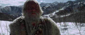 Movie still from “Jeremiah Johnson” (1972), directed by Sydney Pollack – An old man with long white hair and a beard; Close Up shot, Low angle