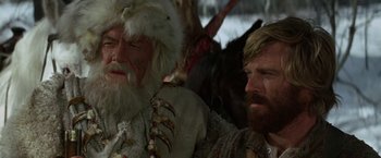 Movie still from “Jeremiah Johnson” (1972), directed by Sydney Pollack – Two men in fur coats and a white beard; Close Up shot, Low angle