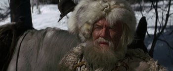 Movie still from “Jeremiah Johnson” (1972), directed by Sydney Pollack – An old man with a beard and a fur hat; Close Up shot, Low angle