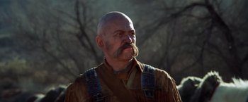 Movie still from “Jeremiah Johnson” (1972), directed by Sydney Pollack – A bald man with a beard and a mustache; Close Up shot, Low angle