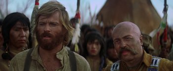 Movie still from “Jeremiah Johnson” (1972), directed by Sydney Pollack – A group of people standing next to each other; Close Up shot, Low angle