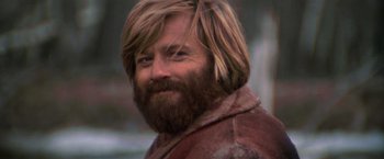 Movie still from “Jeremiah Johnson” (1972), directed by Sydney Pollack – A person with long hair and a beard; Close Up shot, Low angle