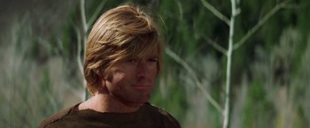 Movie still from “Jeremiah Johnson” (1972), directed by Sydney Pollack – A person with long blonde hair; Close Up shot, Low angle