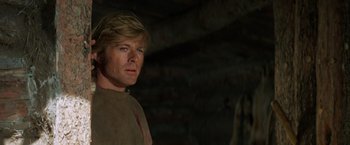 Movie still from “Jeremiah Johnson” (1972), directed by Sydney Pollack – A person in a room; Close Up shot, Over the shoulder angle