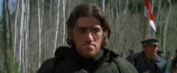 Movie still from “Jeremiah Johnson” (1972), directed by Sydney Pollack – A person wearing glasses; Close Up shot, Low angle