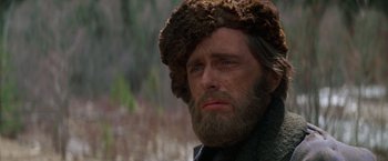 Movie still from “Jeremiah Johnson” (1972), directed by Sydney Pollack – A person wearing a fur hat; Close Up shot, Low angle