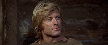 Movie still from “Jeremiah Johnson” (1972), directed by Sydney Pollack – A person with long blonde hair; Close Up shot, Low angle