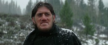 Movie still from “Jeremiah Johnson” (1972), directed by Sydney Pollack – A person wearing a jacket with snow on it; Close Up shot, Low angle