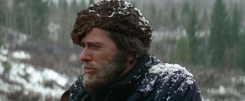 Movie still from “Jeremiah Johnson” (1972), directed by Sydney Pollack – A man with a beard and a fur hat; Close Up shot, Over the shoulder angle