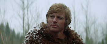 Movie still from “Jeremiah Johnson” (1972), directed by Sydney Pollack – A person wearing a fur coat; Close Up shot, Low angle