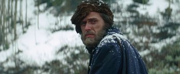 Movie still from “Jeremiah Johnson” (1972), directed by Sydney Pollack – A man with a beard wearing a fur hat; Close Up shot, Low angle