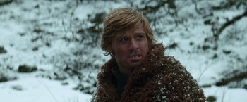 Movie still from “Jeremiah Johnson” (1972), directed by Sydney Pollack – A person wearing a fur coat; Close Up shot, Low angle