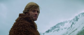 Movie still from “Jeremiah Johnson” (1972), directed by Sydney Pollack – A person wearing a fur coat; Close Up shot, Low angle