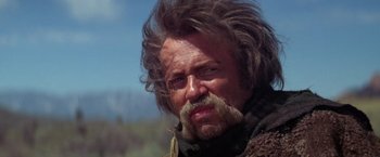 Movie still from “Jeremiah Johnson” (1972), directed by Sydney Pollack – A person with a beard and mustache; Close Up shot, Low angle