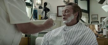 Movie still from “Jersey Boys” (2014), directed by Clint Eastwood – A man getting a shave from a barber; Close Up shot, Over the shoulder angle