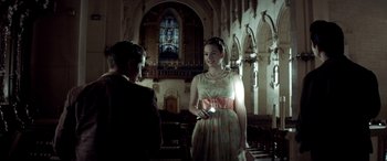 Movie still from “Jersey Boys” (2014), directed by Clint Eastwood – A man and a woman standing in front of a church; Medium shot, Over the shoulder angle