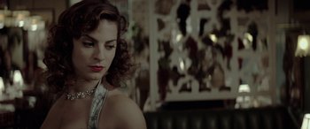 Movie still from “Jersey Boys” (2014), directed by Clint Eastwood – A beautiful woman with red hair and a silver dress; Close Up shot, Low angle