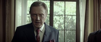 Movie still from “Jersey Boys” (2014), directed by Clint Eastwood – An older man wearing a suit and tie; Close Up shot, Low angle