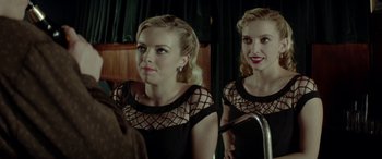 Movie still from “Jersey Boys” (2014), directed by Clint Eastwood – A woman looking at herself in the mirror; Medium shot, Over the shoulder angle