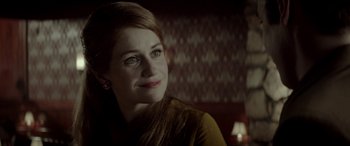 Movie still from “Jersey Boys” (2014), directed by Clint Eastwood – A woman is smiling for the camera; Close Up shot, Over the shoulder angle