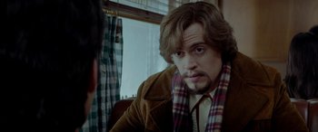 Movie still from “Jersey Boys” (2014), directed by Clint Eastwood – A person sitting in front of a window; Close Up shot, Over the shoulder angle