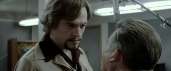 Movie still from “Jersey Boys” (2014), directed by Clint Eastwood – A person with a beard; Close Up shot, Over the shoulder angle