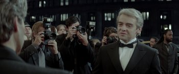 Movie still from “Jersey Boys” (2014), directed by Clint Eastwood – A group of people taking pictures with cameras; Medium shot, Over the shoulder angle