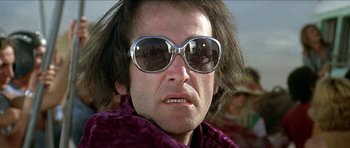 Movie still from “Jesus Christ Superstar” (1973), directed by Norman Jewison – A person wearing sunglasses; Close Up shot, Low angle