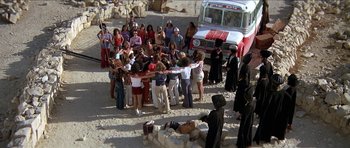 Movie still from “Jesus Christ Superstar” (1973), directed by Norman Jewison – A group of people standing around a fire truck; Wide shot, High angle