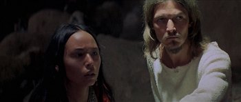 Movie still from “Jesus Christ Superstar” (1973), directed by Norman Jewison – A man and a woman standing next to each other; Close Up shot, Low angle