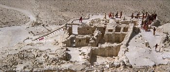 Movie still from “Jesus Christ Superstar” (1973), directed by Norman Jewison – A group of people standing on top of a stone structure; Extreme Wide shot, High angle