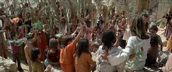 Movie still from “Jesus Christ Superstar” (1973), directed by Norman Jewison – A group of people sitting in the grass; Wide shot, High angle
