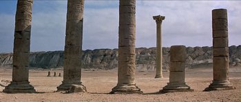 Movie still from “Jesus Christ Superstar” (1973), directed by Norman Jewison – A group of pillars that are in the dirt; Extreme Wide shot, Low angle