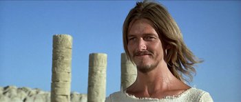 Movie still from “Jesus Christ Superstar” (1973), directed by Norman Jewison – A person with long brown hair and a beard; Close Up shot, Low angle