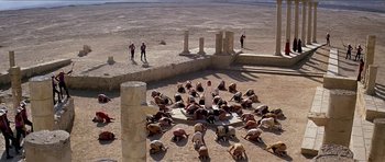 Movie still from “Jesus Christ Superstar” (1973), directed by Norman Jewison – A group of people in a circle on the ground; Extreme Wide shot, High angle