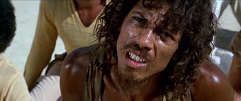 Movie still from “Jesus Christ Superstar” (1973), directed by Norman Jewison – A person with long hair and a beard; Close Up shot, Low angle